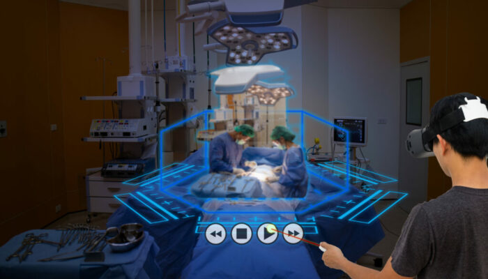 Smart medical technology concept, Medical student use augmented reality technology in operation room for learning the surgery patient , in 3d , it can help to learn various example of surgery