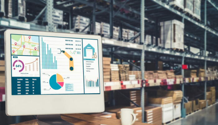 Warehouse management innovative software in computer for real time monitoring of goods package delivery . Computer screen showing smart inventory dashboard for storage and supply chain distribution .