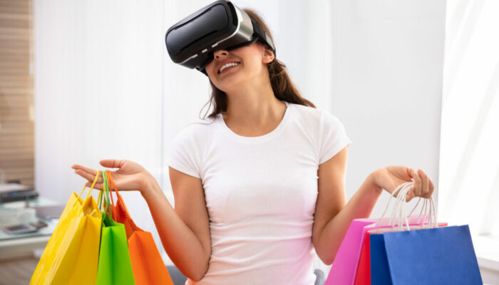 Happy Young Woman Holding Many Paper Bags Shopping With Virtual Reality Glasses